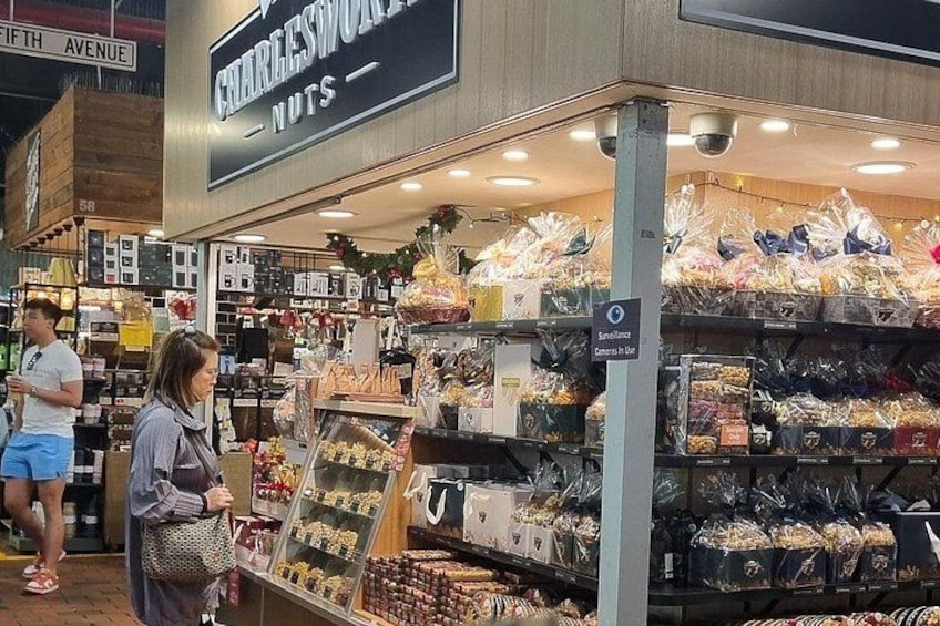 A store named 'CHARLESWORTH NUTS' with shelves of nuts and dried fruits. 3