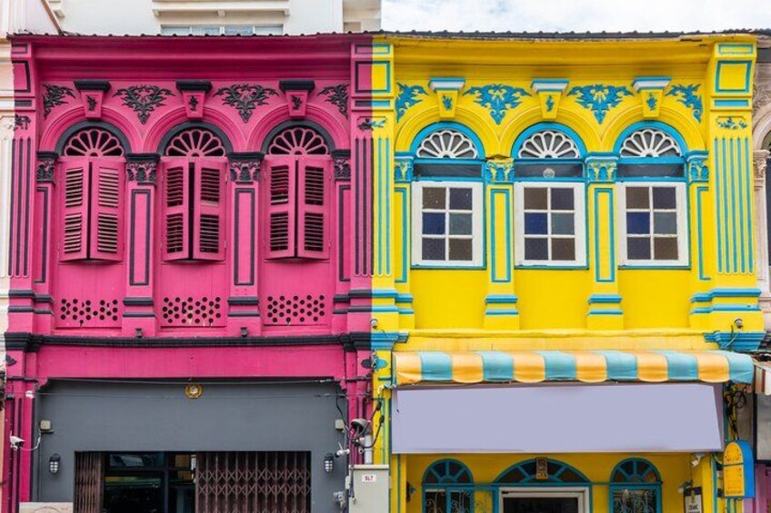A row of colorful buildings with distinct architectural styles, including pink, yellow, and blue facades with decorative window frames and awnings. 4