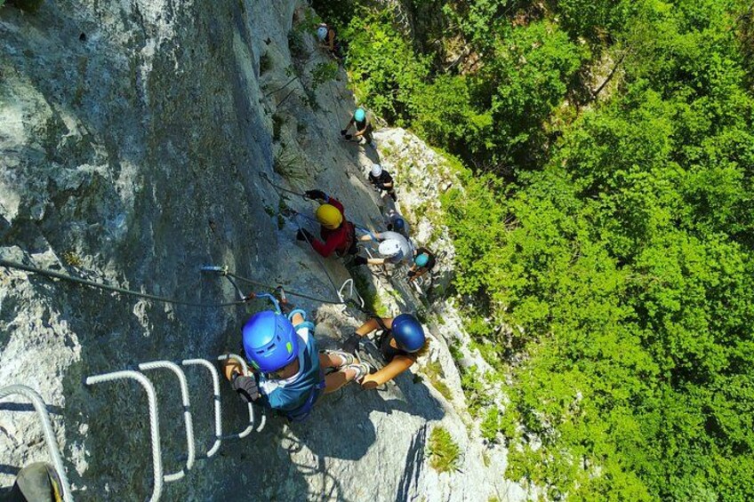 A group of people climbing a rocky mountain path. 3