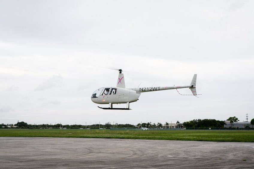 A helicopter with registration N212WT on a runway. 3