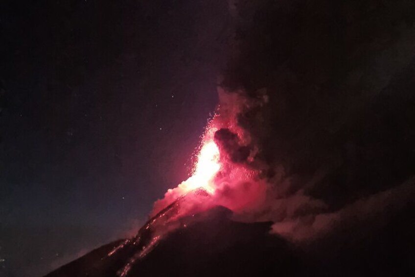 A volcano with a glowing lava flow. 2