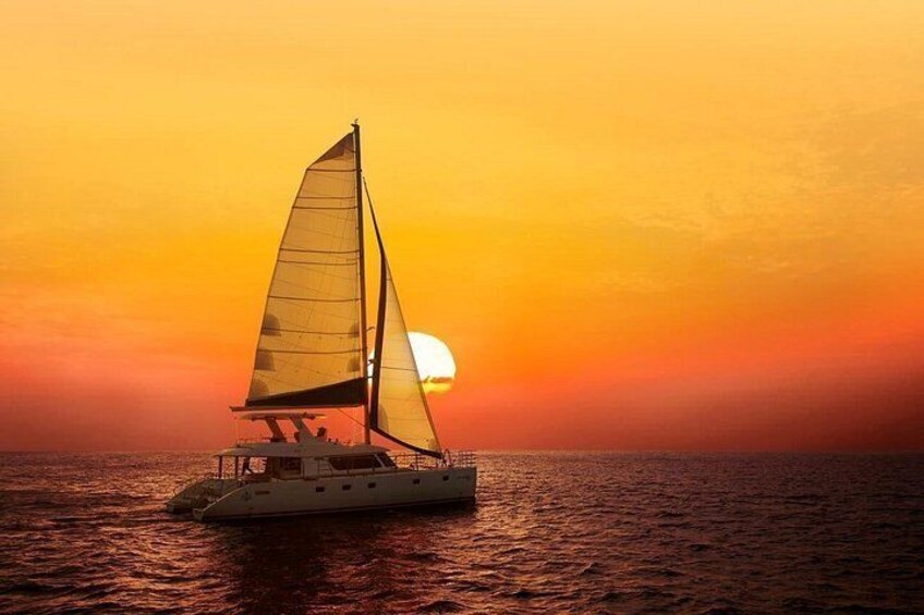 A sailboat on calm waters during sunset. 1