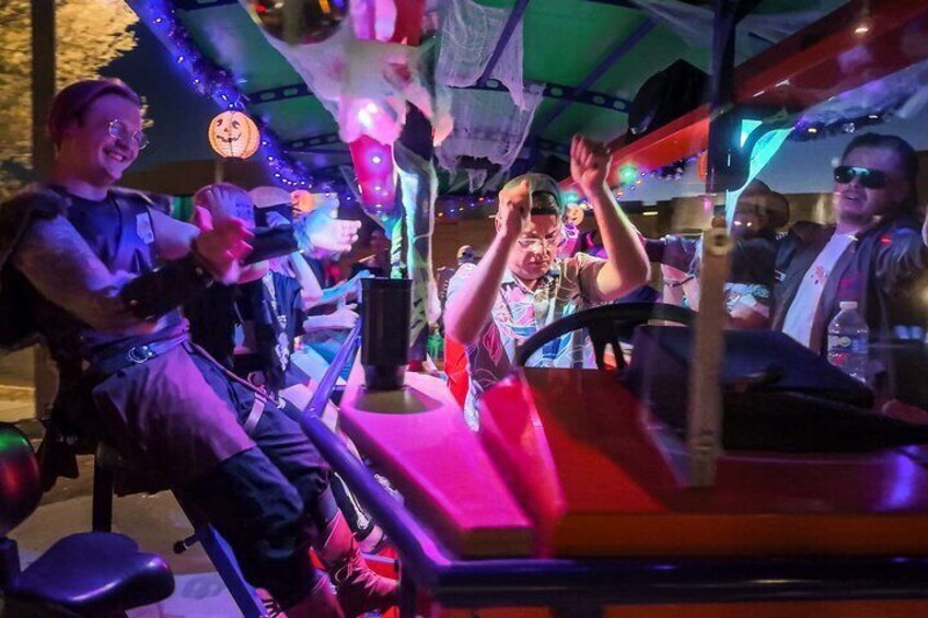 A ride with colorful lights and a pumpkin decoration. 4