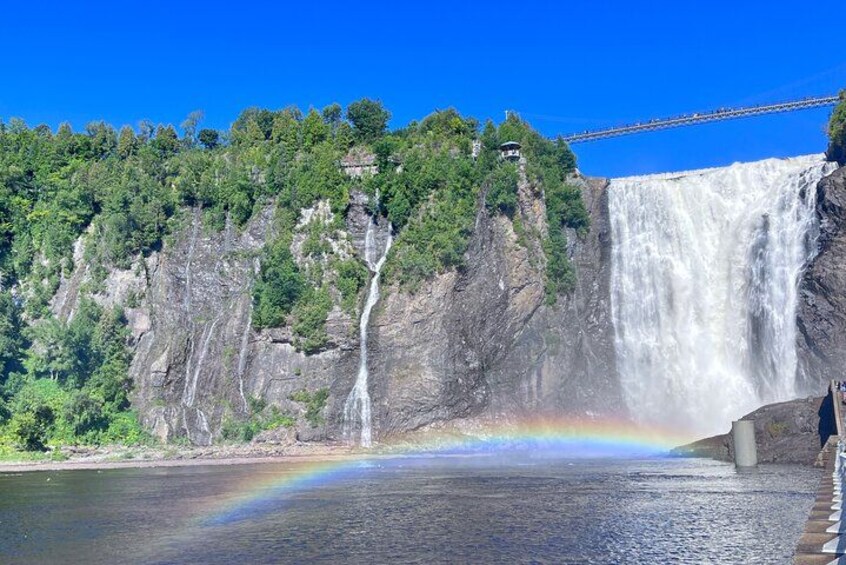 A waterfall, a rainbow, and a bridge. 4