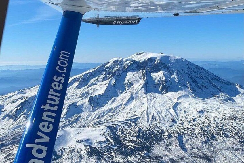 A snow-covered mountain with a clear sky. 2