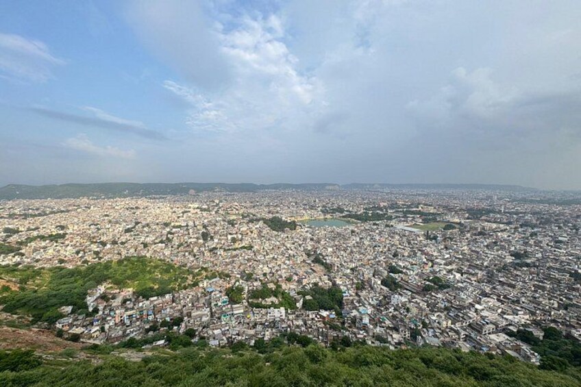 A densely populated cityscape with a large body of water in the center. 2