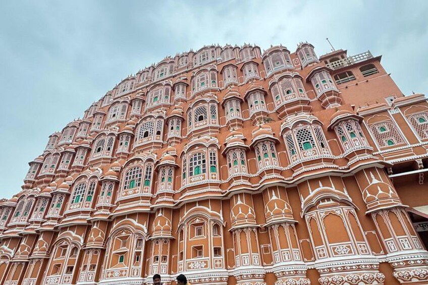 A large, ornate building with intricate architectural details and multiple windows. 1