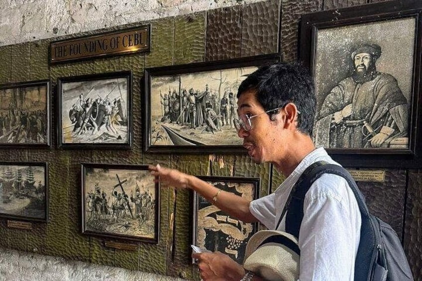 A wall with historical photographs and a sign reading 'THE FOUNDING OF CEBU.' 3