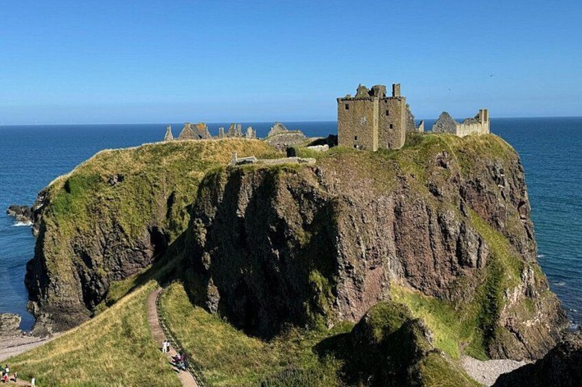 A coastal castle on a cliff overlooking the sea. 1