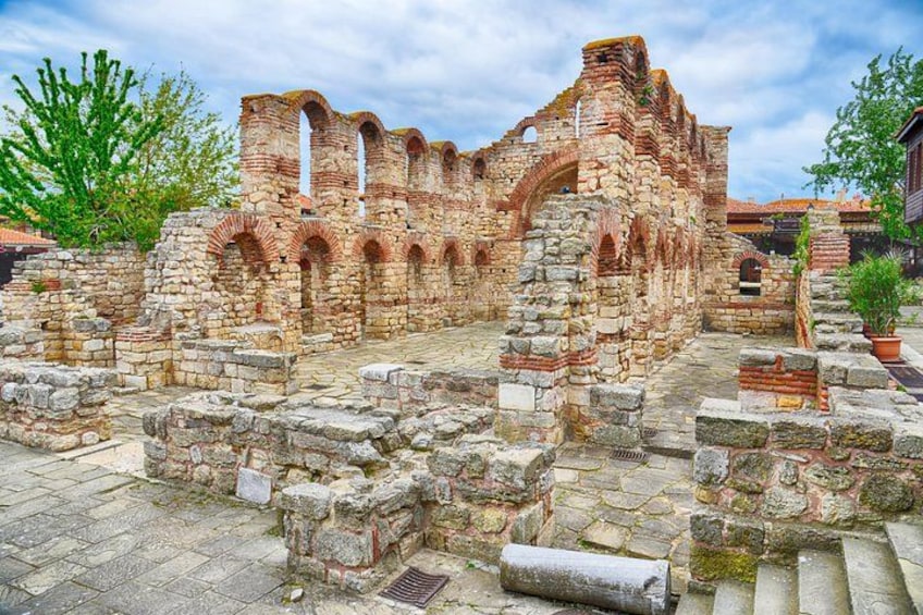 Ancient ruins with arches and stone walls. 3