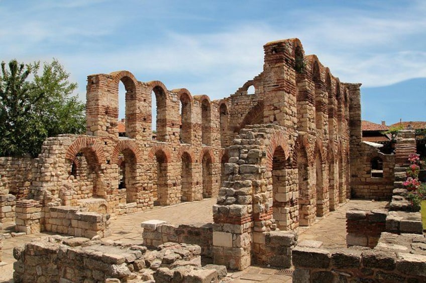 Ancient ruins with arches and stone walls. 2