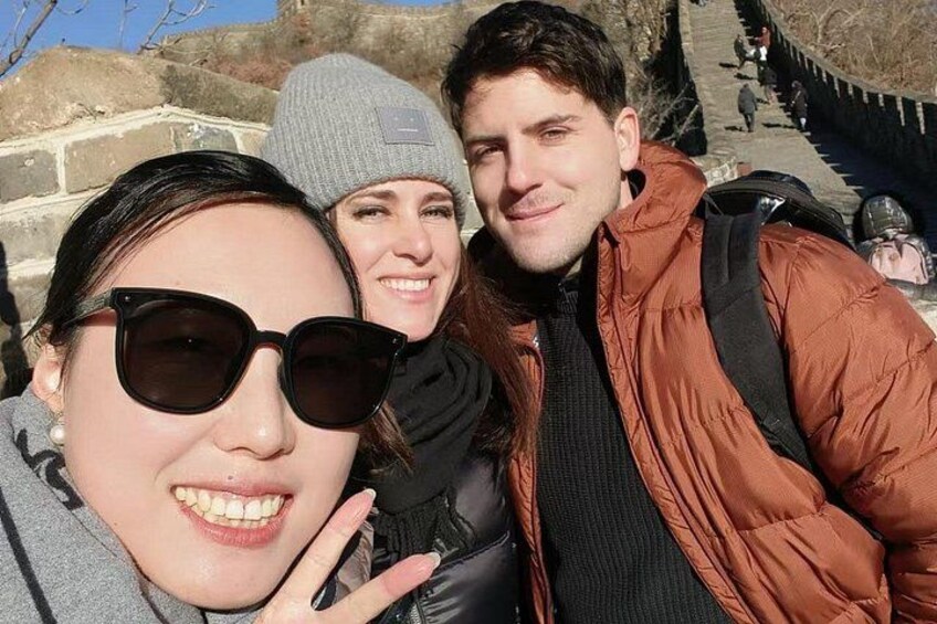A group of people outdoors, possibly on a hike or at a historical site. 3