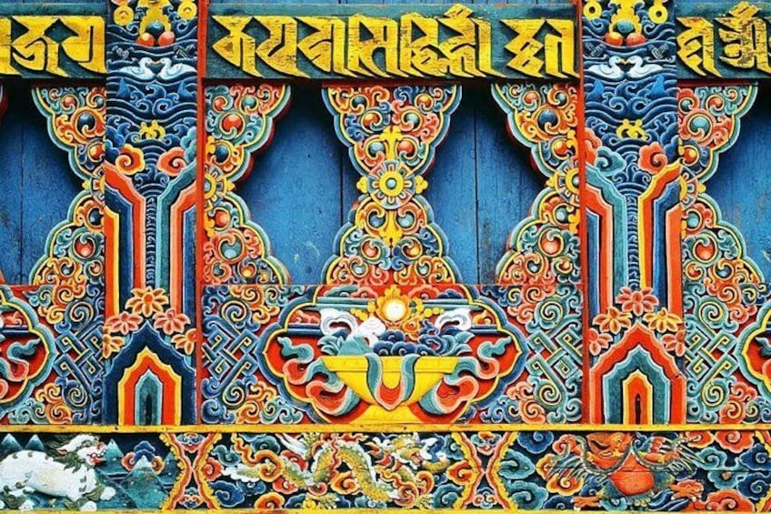 A detailed traditional mural with intricate patterns and designs. 4