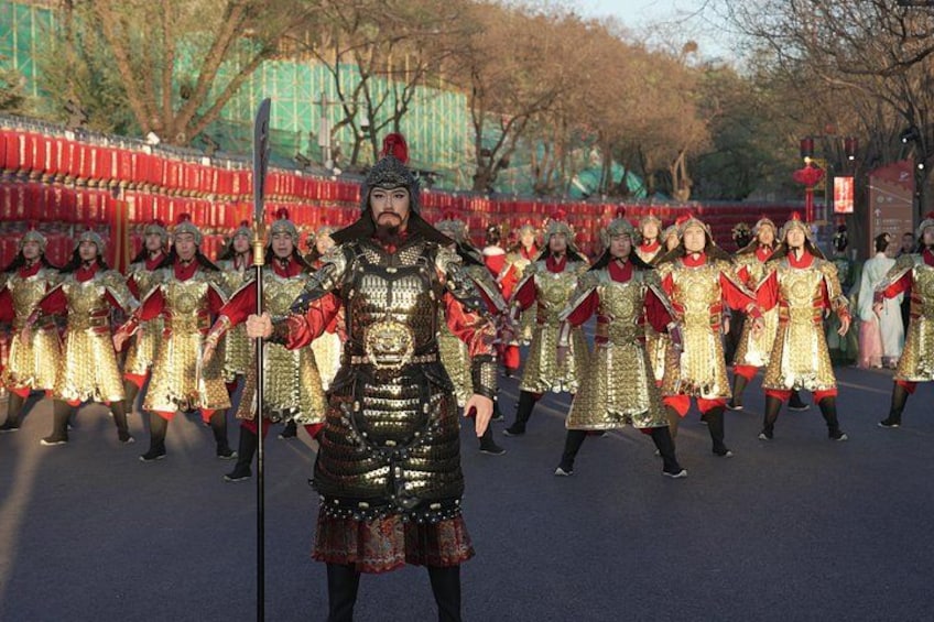 A group of people in historical armor performing a synchronized routine. 5