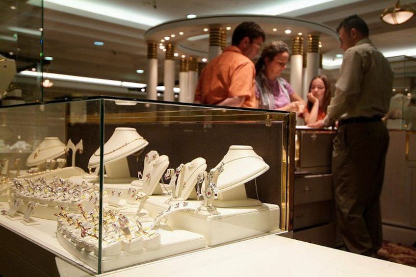 A jewelry display case with various items. 2