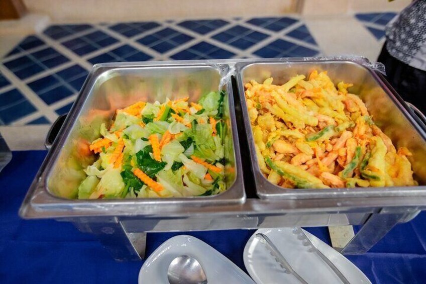 Two metal trays with mixed vegetable salads. 5