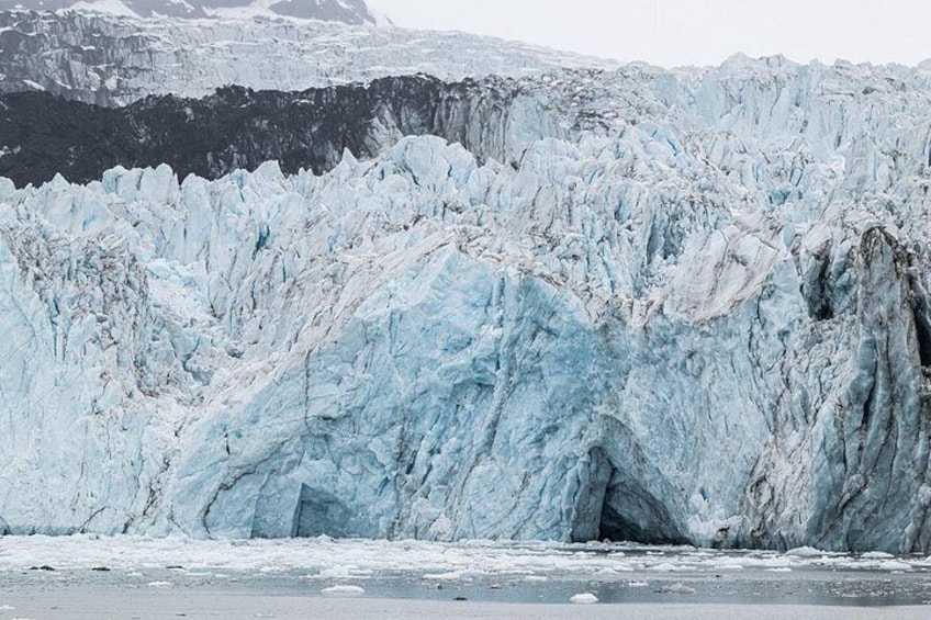 A glacier with a crevasse and ice formations. 3