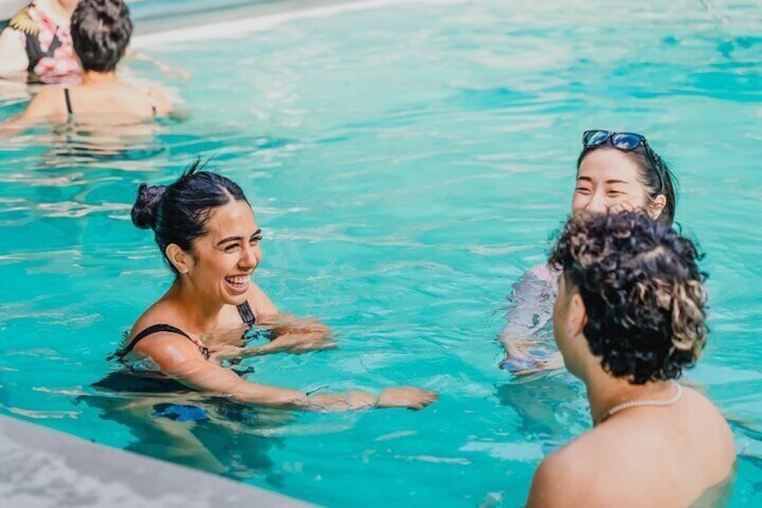 A swimming pool with people in the water. 5
