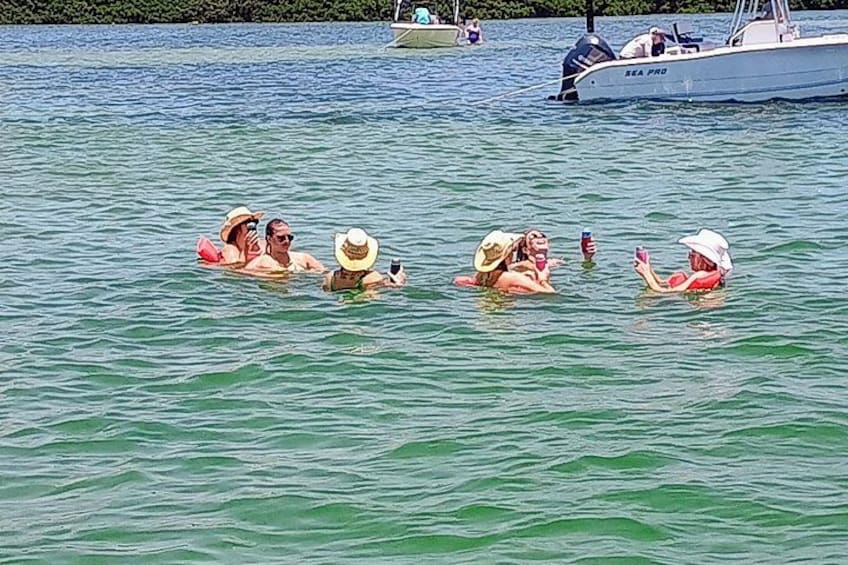 Private Clearwater boat tours with Captain Clearwater on Salt Therapy. USCG Master Captain, small groups, dolphins, sandbars, islands, and smooth sunset rides. Boat Like a Local. 3
