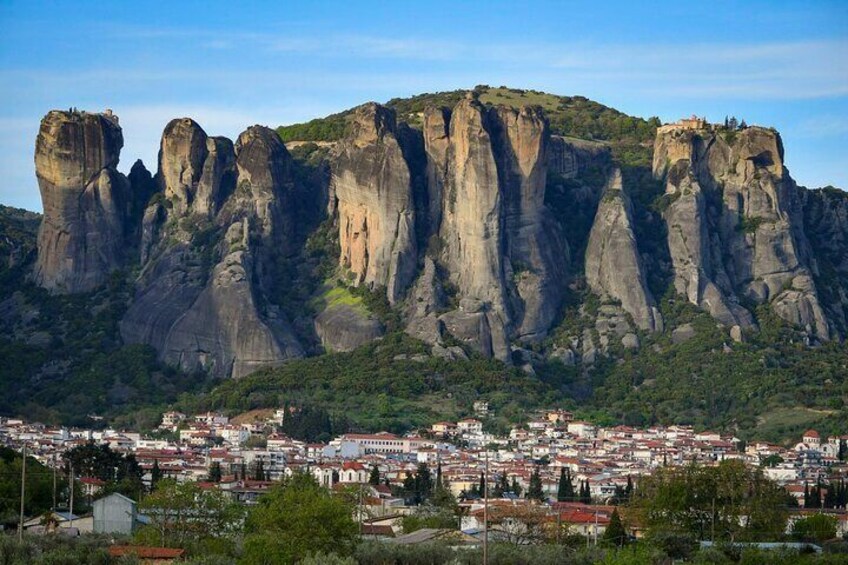 A town with a prominent mountain range in the background. 3