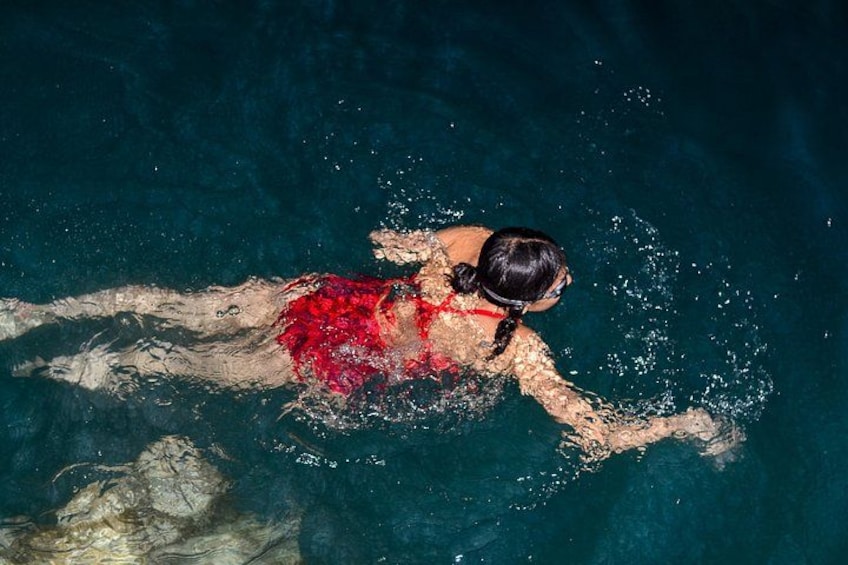 A person swimming in a pool. 3