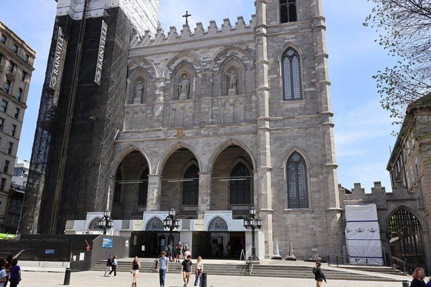A historic church with a large facade, arched windows, and a prominent entrance. 5