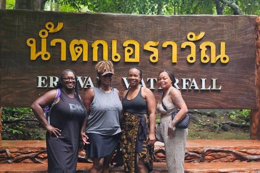 A wooden sign with Thai text and the words "ERVA VATERFALL" in English. 1
