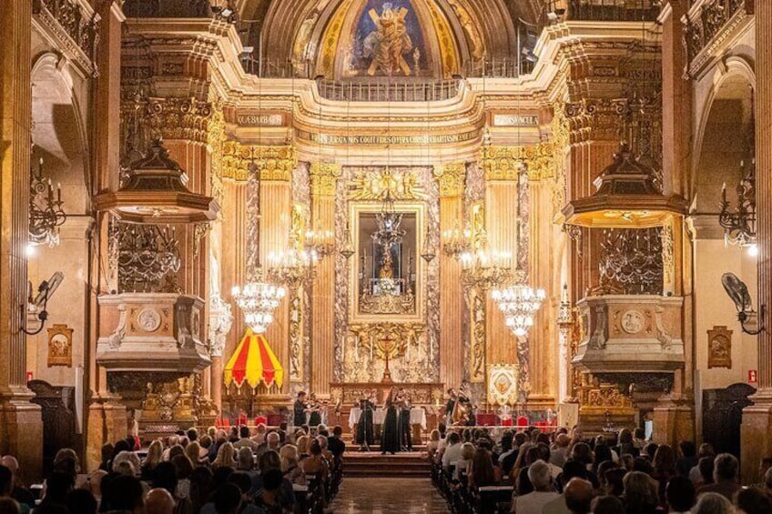 A grand, ornately decorated church interior with a large congregation. 1