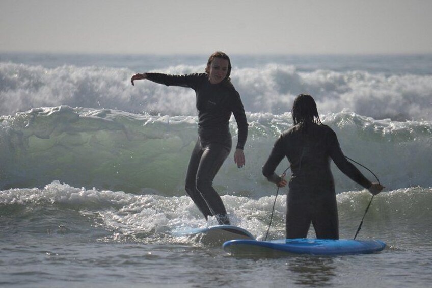 Two people on paddleboards in the ocean. 2