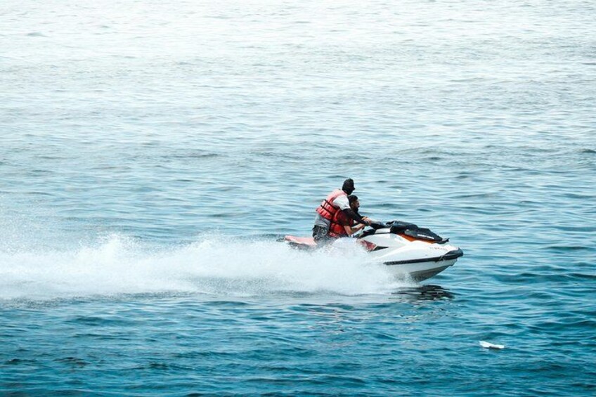 A person jet-skiing on a body of water. 3