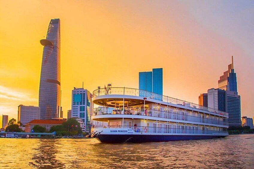 A river cruise ship with a city skyline in the background. 2