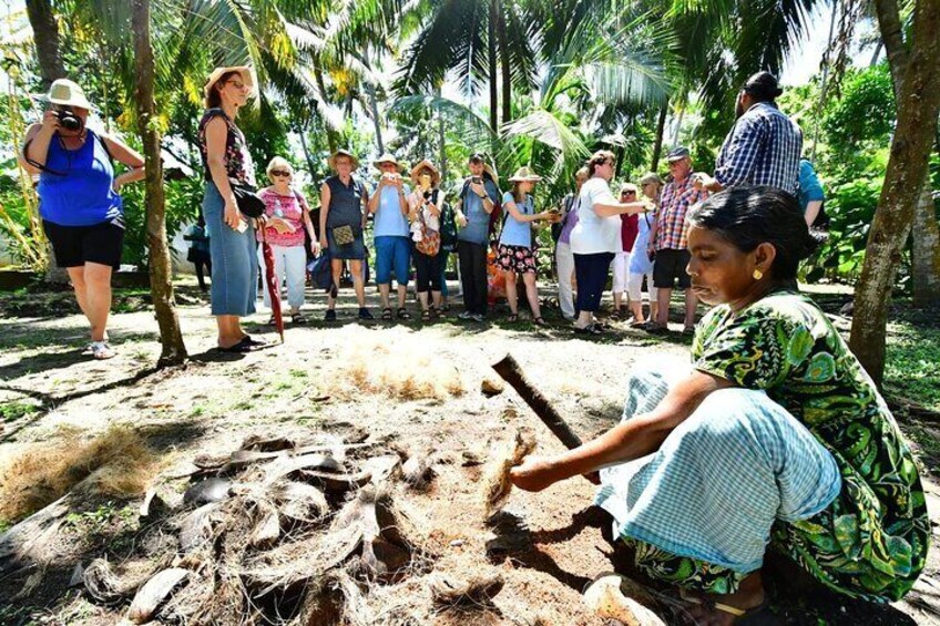 A group of people observing an excavation site with tools and a shovel. 5