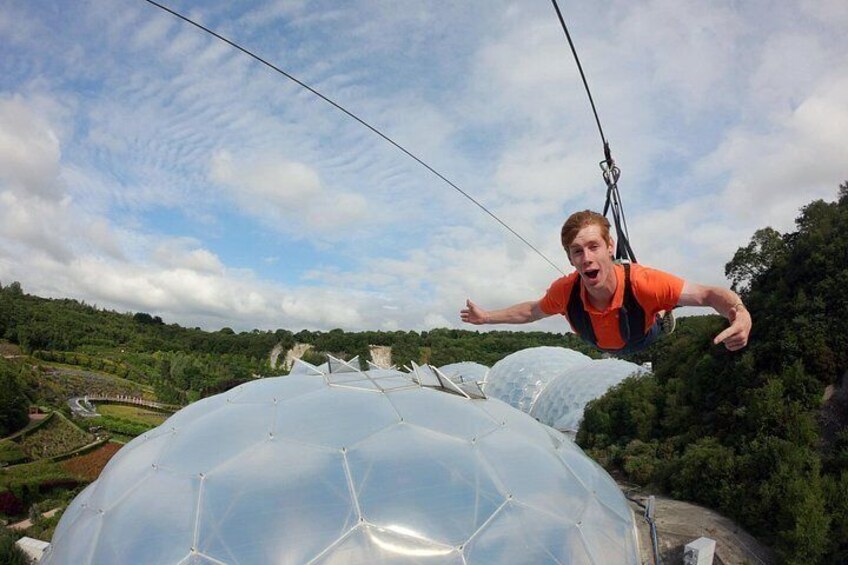 A person bungee jumping from a large transparent dome. 2