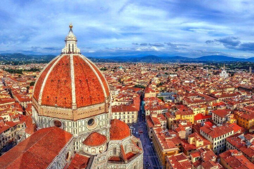 A cityscape with a prominent dome and red-roofed buildings. 4