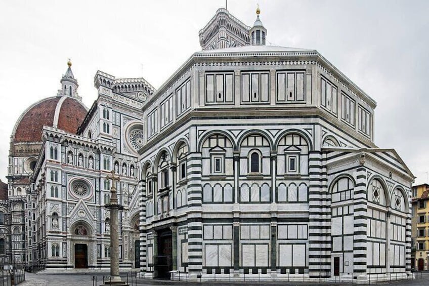 A detailed architectural structure with intricate designs and a prominent dome. 1