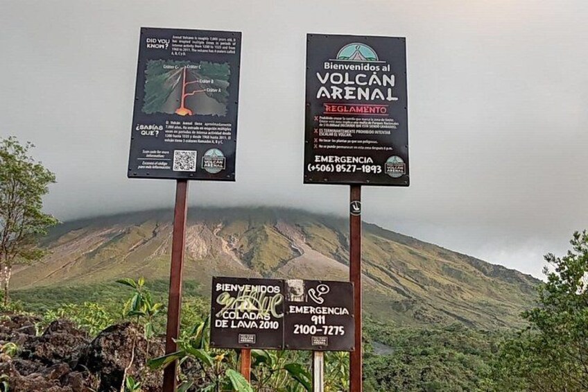A volcanic landscape with informational signs. 5