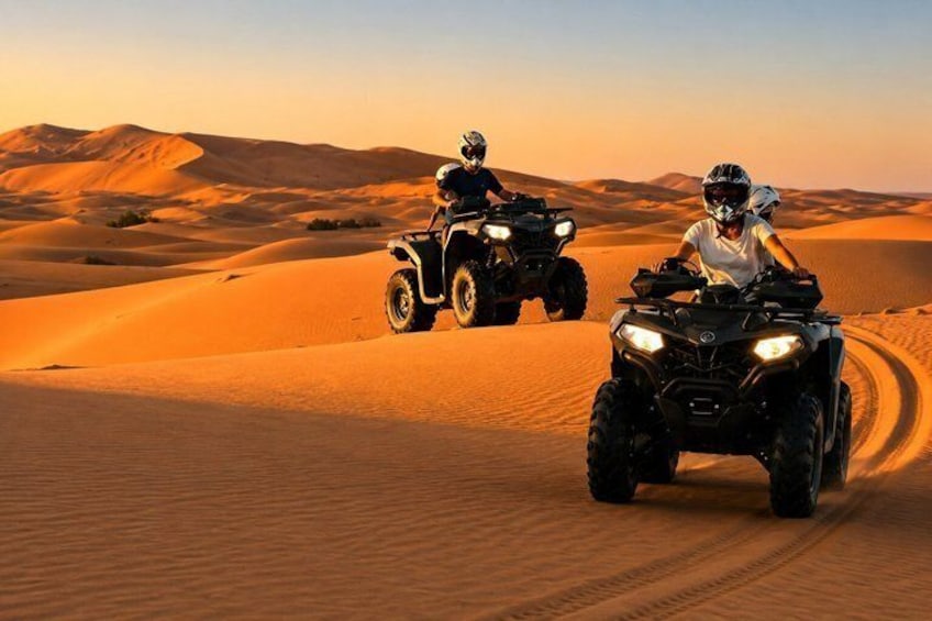 Two off-road vehicles on a desert sand dune. 1