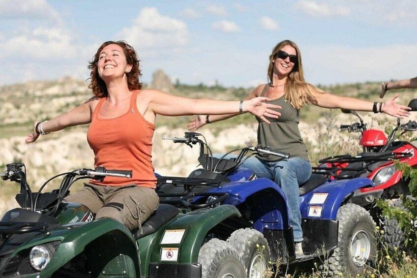 Two people on ATVs in a natural landscape. 4