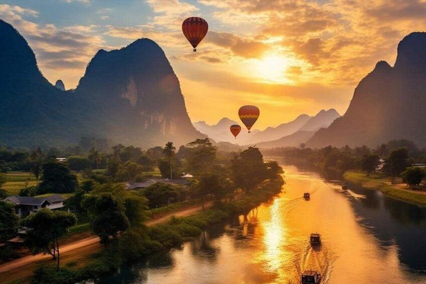 A river with hot air balloons, a bridge, and mountains. 2
