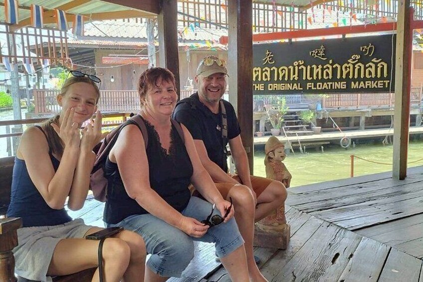 A wooden structure with a sign that reads 'The Original Floating Market'. 5