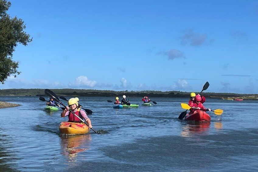 People kayaking on a calm river. 2