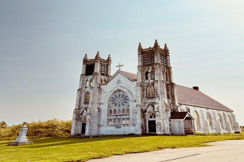 A large, historic church with a prominent steeple and arched windows. 4