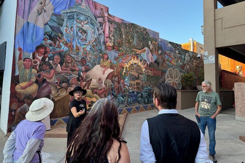 A mural with people and musical instruments. 2