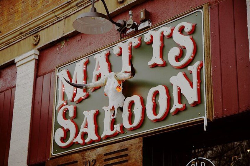 A vintage sign with the words 'Mattis Saloon' and a bull's head. 2
