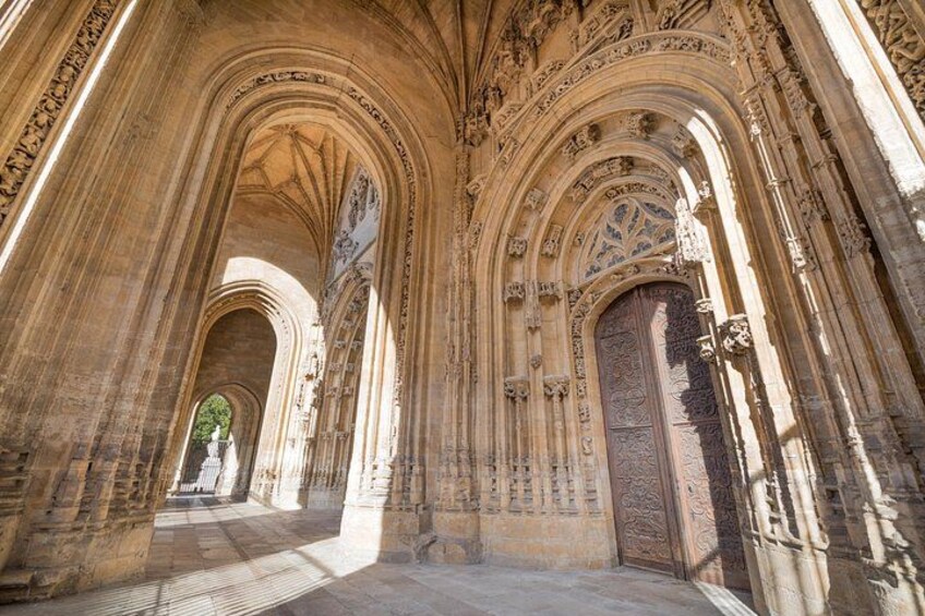 A cathedral interior with Gothic arches and detailed stone carvings. 4