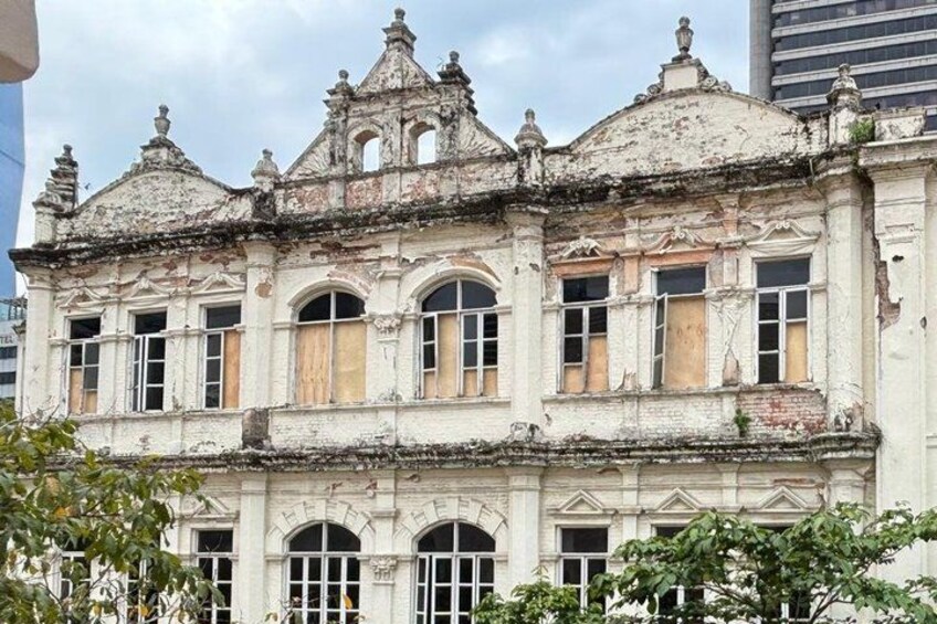 A historic building with ornate architecture, including arched windows and decorative elements. 2