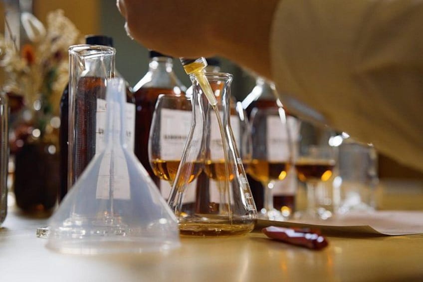 Laboratory glassware, including beakers and flasks, on a table. 3