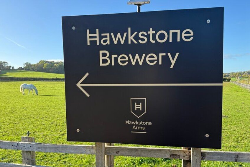A sign for Hawstone Brewery with a directional arrow. 2