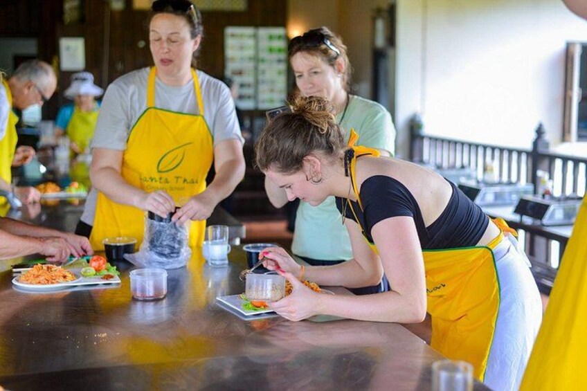 People preparing food at a counter. 4