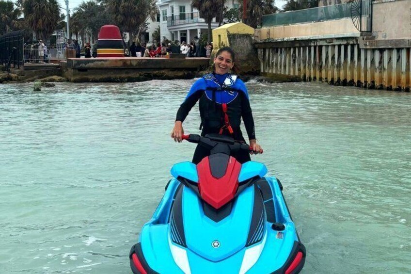A person riding a jet ski on a body of water. 4